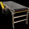 Flat belt conveyor with end drive designed for smooth product transport and accumulation flow.