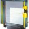 Vehicle restraint control panel with communication lights for safe trailer loading dock operations.