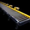 Motorized roller conveyor with side guides designed for controlled product transport and handling.