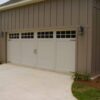 A double CHI Overlay Carriage House Garage Door with stockton windows, white finish, and design 31 with hardware