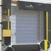 Full-perimeter dock shelter with foam side pads and head curtain providing weather-tight trailer seals.