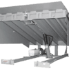 Vertical storing dock leveler with steel deck and hydraulic lift system for loading dock access.