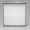 Rolling steel service door with slatted curtain and overhead barrel for commercial applications.