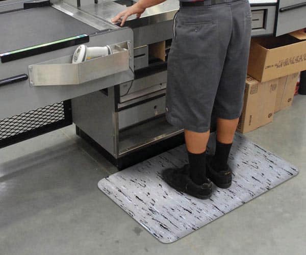K Marble Foot Mat placed behind cashier's register