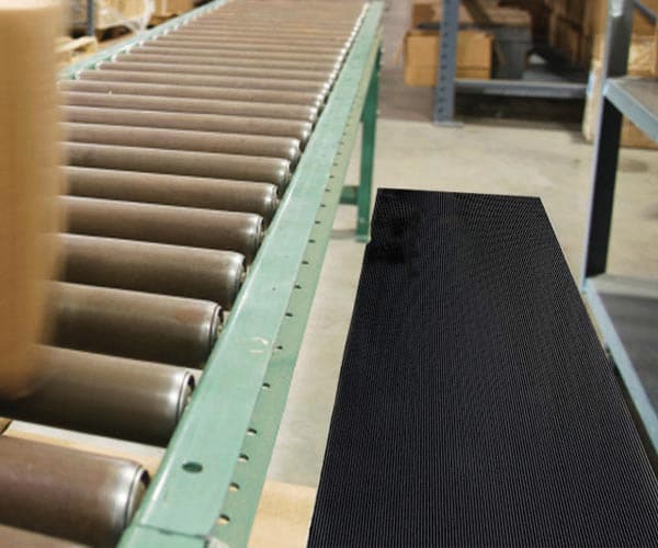 Tuft Foot Runner Floor Mat next to Roller Conveyor