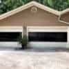 Two CHI Sterling Garage Doors withe two full-view window panels with tinted glass and white panels