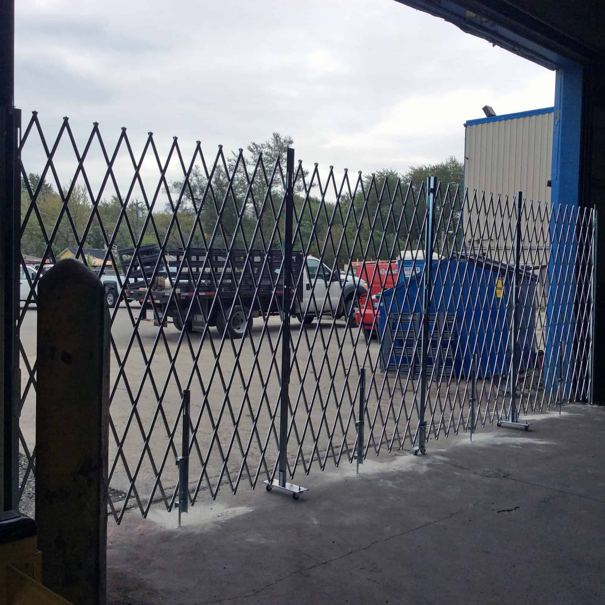 Heavy Duty Pair Folding Security Gates Barron Equipment & Overhead Doors