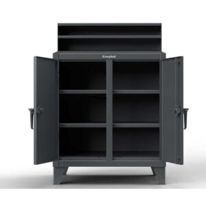 Dark gray shop desk with four open compartment, one drawer, and a riser shelf, standing on 6-inch legs.