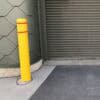 Flat Top Bollard Cover in use near garage door