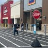Pyramid Sign Base in use in parking lot in crosswalk holding a stop sign