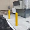 0.25 Inch Thick Nominal Bollard Covers in use near air conditioning unit for building