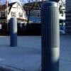 Ribbed Decorative Bollard Covers Between a Road and a Walkway