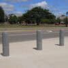 Ribbed Decorative Bollard Covers Between a Road and a Walkway