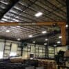 HSI 313 cantilever jib crane positioned over manufacturing floor for material handling
