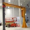 Heavy-duty jib crane with hoist in industrial workspace